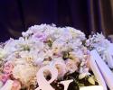This enchanting white and pink floral centerpiece would be perfect for any wedding reception. 