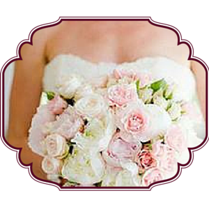 Bride carrying a pale colored bouquet of flowers
